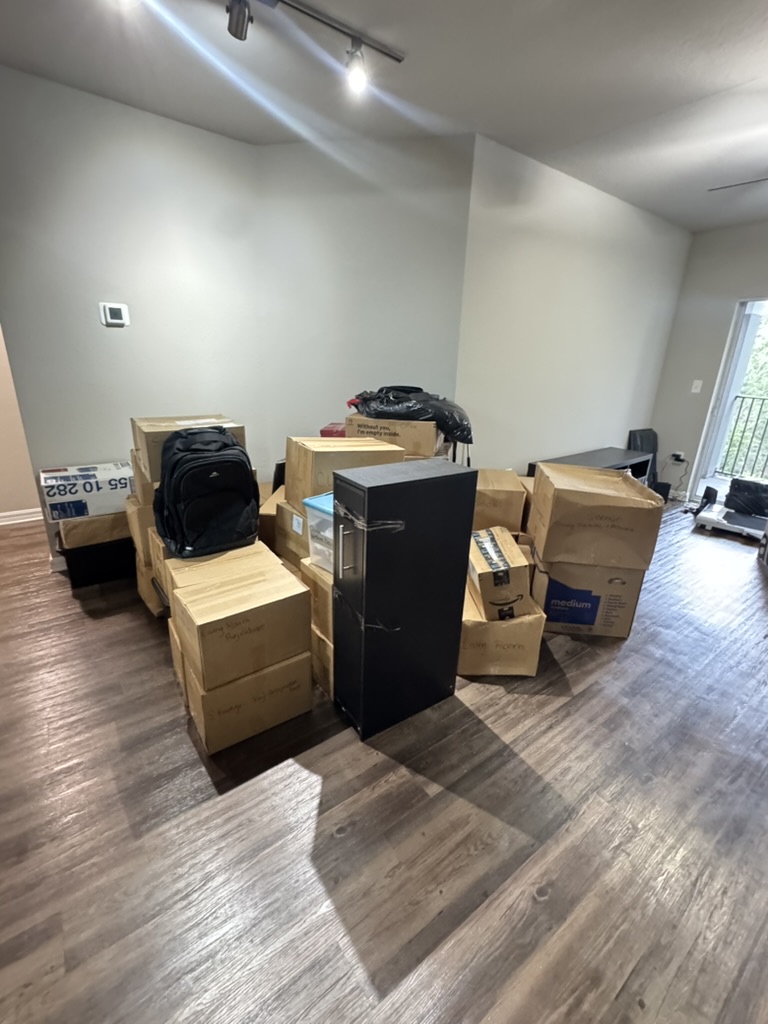 Stack of cardboard boxes in an empty apartment ready to be moved