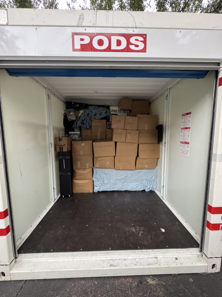 Toro Movers loading PODS storage container for a Davenport vacation home turnover