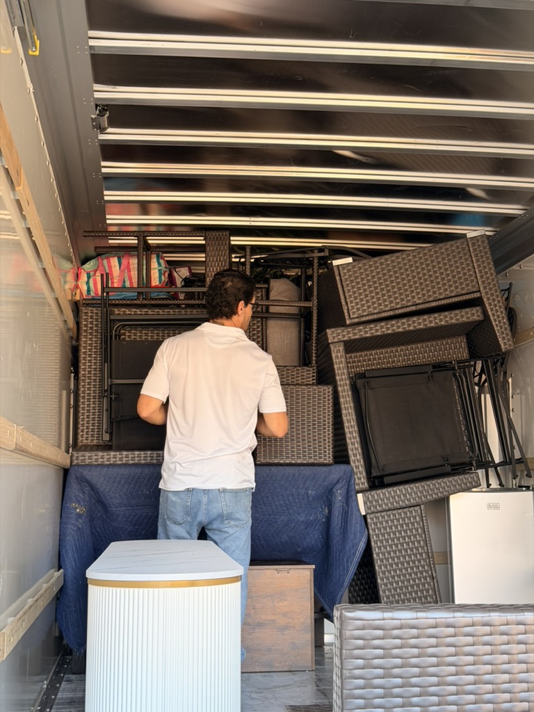Toro mover organizing patio furniture inside the moving truck